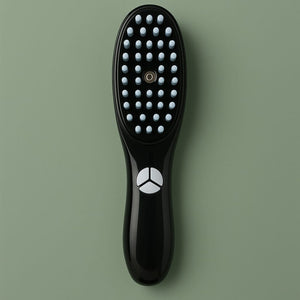 VeiVie 3-in-1 Hairbrush Scalp Massager on green background
